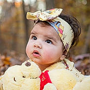 Kate joined the competition — help win amazing prizes! baby, child, face, headband, plush_toy, stuffed_animal, winnie_the_pooh, autumn, outdoor, forest, leaves, curly_hair, cute, expression, portrait, soft_lighting, closeup, cuddly, toy, nature