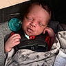 baby, sleeping, car_seat, blanket, pacifier, infant, child, closeup, face, hand, clothing, comfort, rest, newborn, indoor, portrait, cute, peaceful, safety, soft