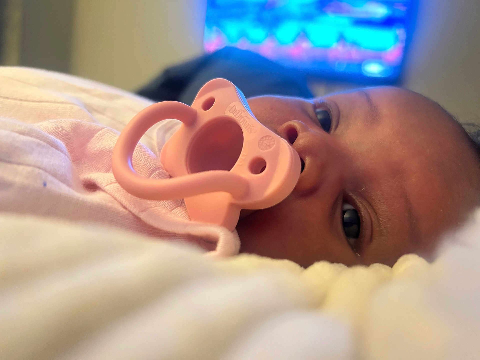 Tatem joined the competition — help win amazing prizes! baby, pacifier, close_up, infant, face, eyes, lying_down, pink, soft, blanket, indoors, young_child, skin, mouth, comfort, cuteness, portrait, child, sleepwear, resting