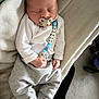 Albie joined the competition — help win amazing prizes! baby, sleeping, pacifier, clothing, white_shirt, grey_pants, blanket, indoor, infant, beads, peaceful, cozy, hands, feet, naptime, soft_texture, comfort, person, cute, child