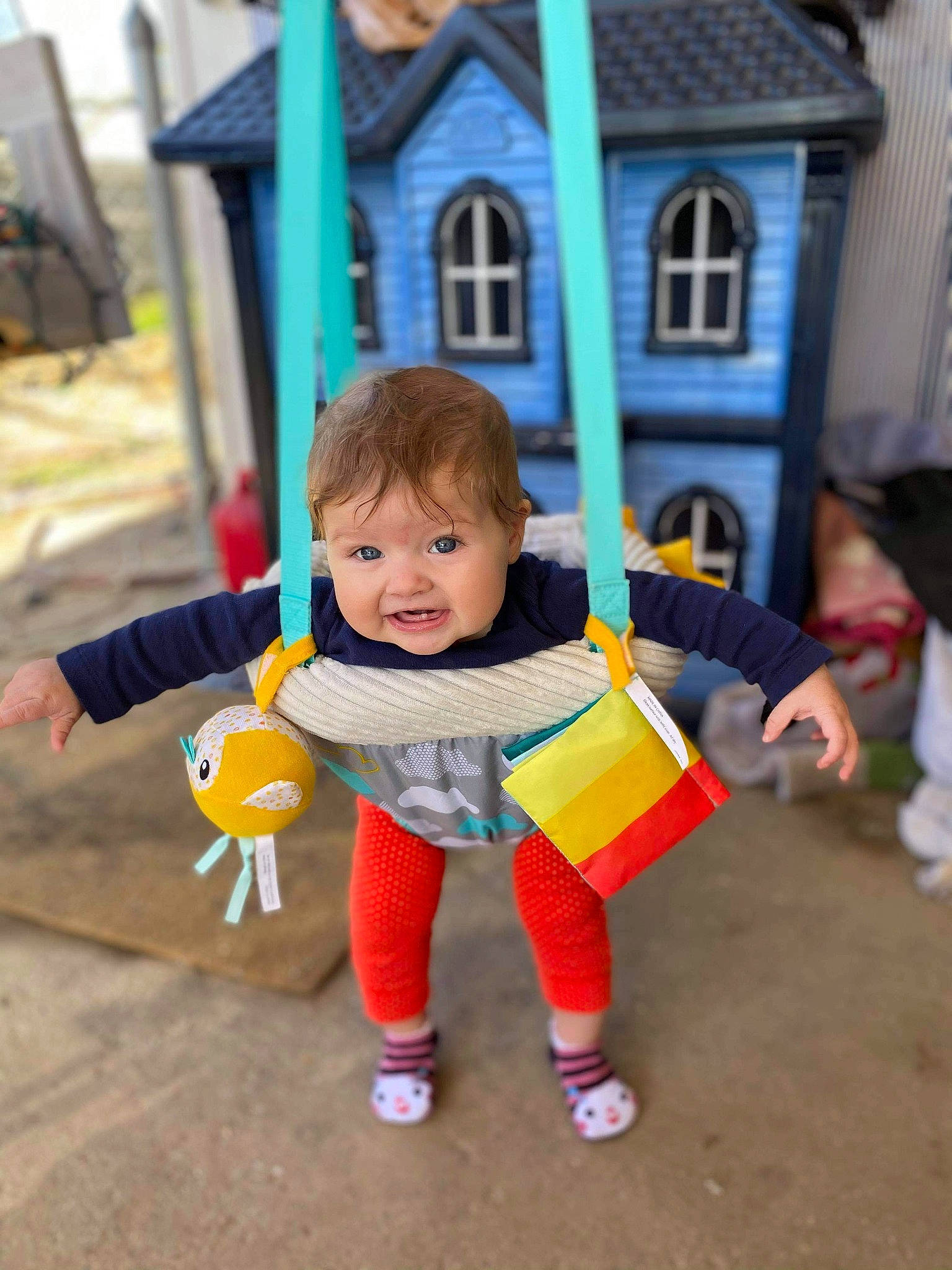 Elena is registered to the contest to win money with this photo: baby, baby_toddler_clothing, child, city, event, fun, grass, happy, jacket, leisure, orange, outdoor_play_equipment, person, play, recreation, sitting, toddler, tree, vacation, window