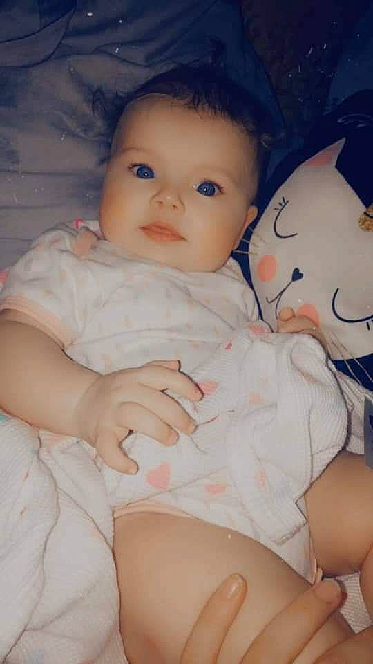 Elena is registered to the contest to win money with this photo: baby, baby_toddler_clothing, cheek, comfort, eye, face, finger, gesture, happy, head, human_body, iris, lip, mouth, nose, person, pink, skin, stomach, thigh