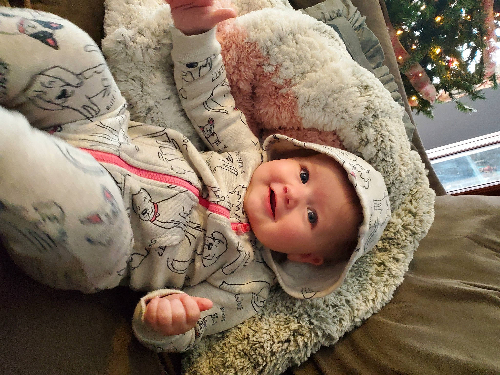 Elena is registered to the contest to win money with this photo: baby, chest, child, comfort, event, flooring, fun, fur, gesture, happy, head, headgear, headwear, human_body, human_leg, joy, linens, mouth, nail, person