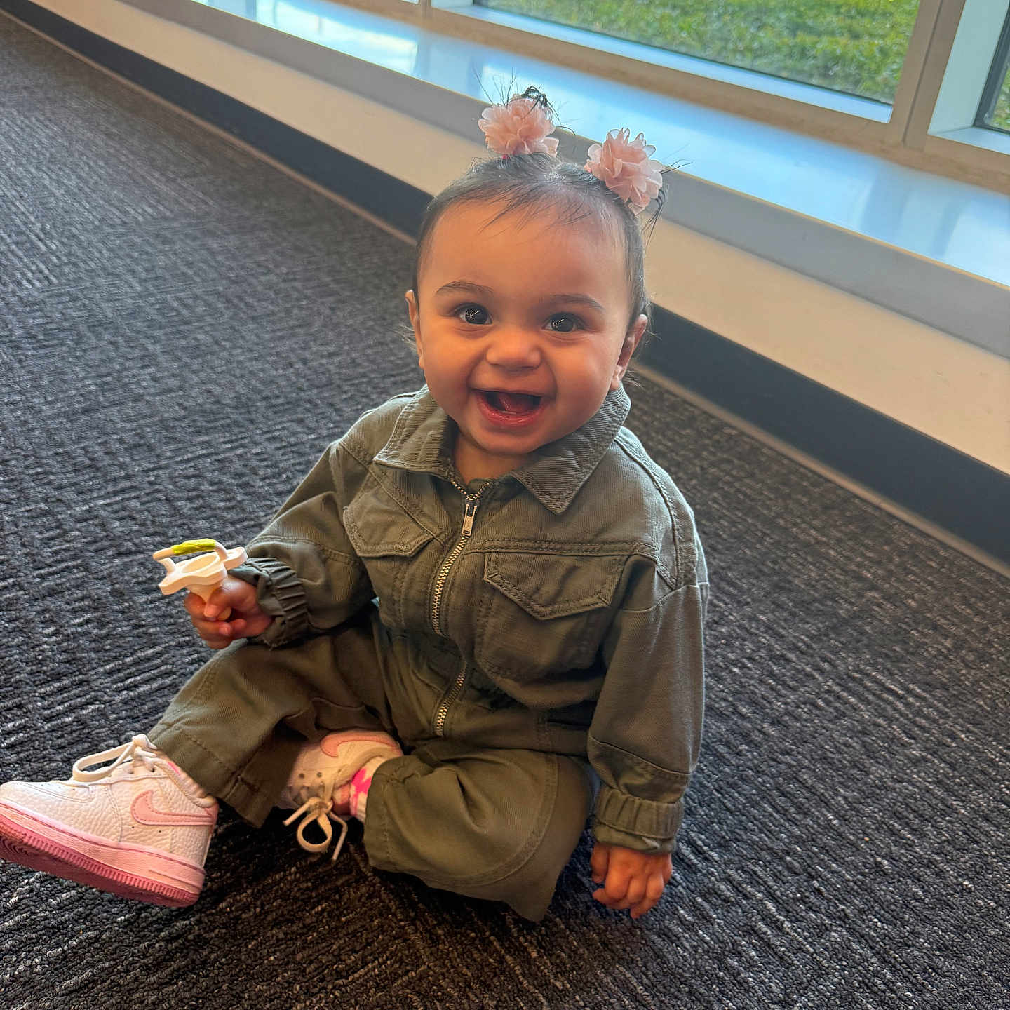 Carlyssa is registered to the contest to win money with this photo: baby, bodypart, clothing, coat, face, finger, footwear, hand, hardwood, head, jacket, jeans, pants, person, photography, portrait, runningshoe, shoe, sitting, sneaker
