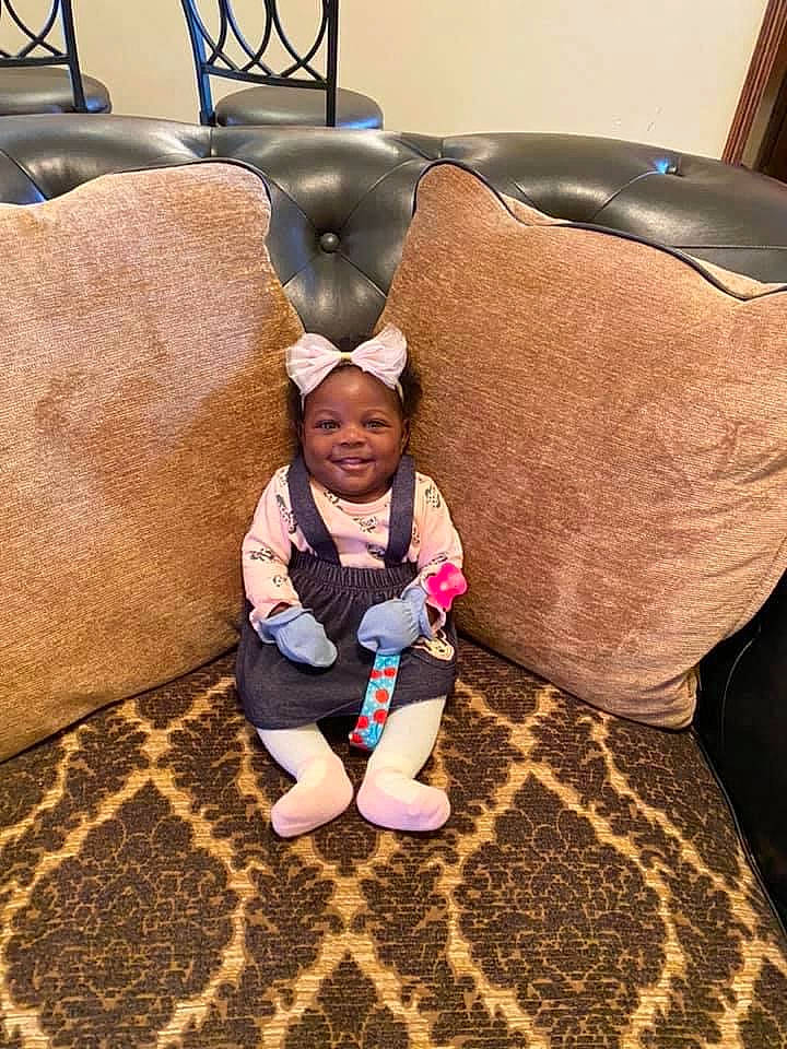 Nevaeh joined the competition — help win amazing prizes! child, comfort, couch, eye, floor, flooring, fun, grass, happy, human_leg, jacket, joy, leisure, linens, person, play, recreation, sitting, smile, t_shirt