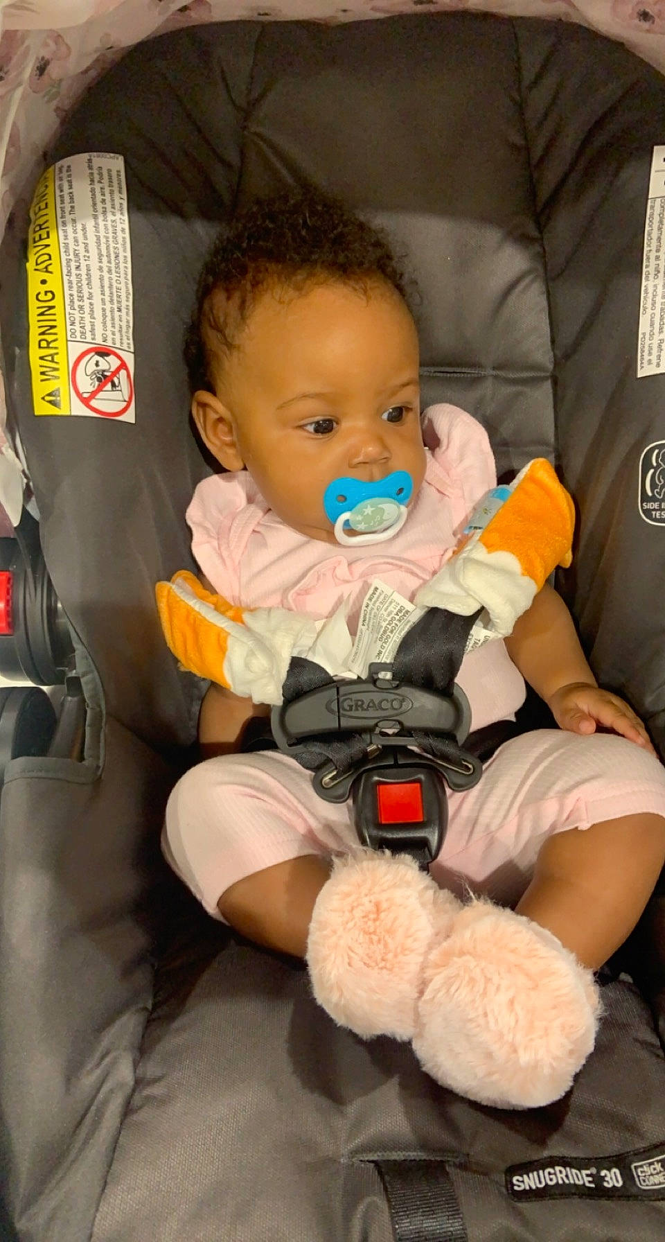 Janiya is registered to the contest to win money with this photo: baby, baby_carriage, baby_products, baby_toddler_clothing, car_seat, chair, cheek, child, comfort, face, finger, human, nail, orange, person, product, sitting, skin, teddy_bear, toddler