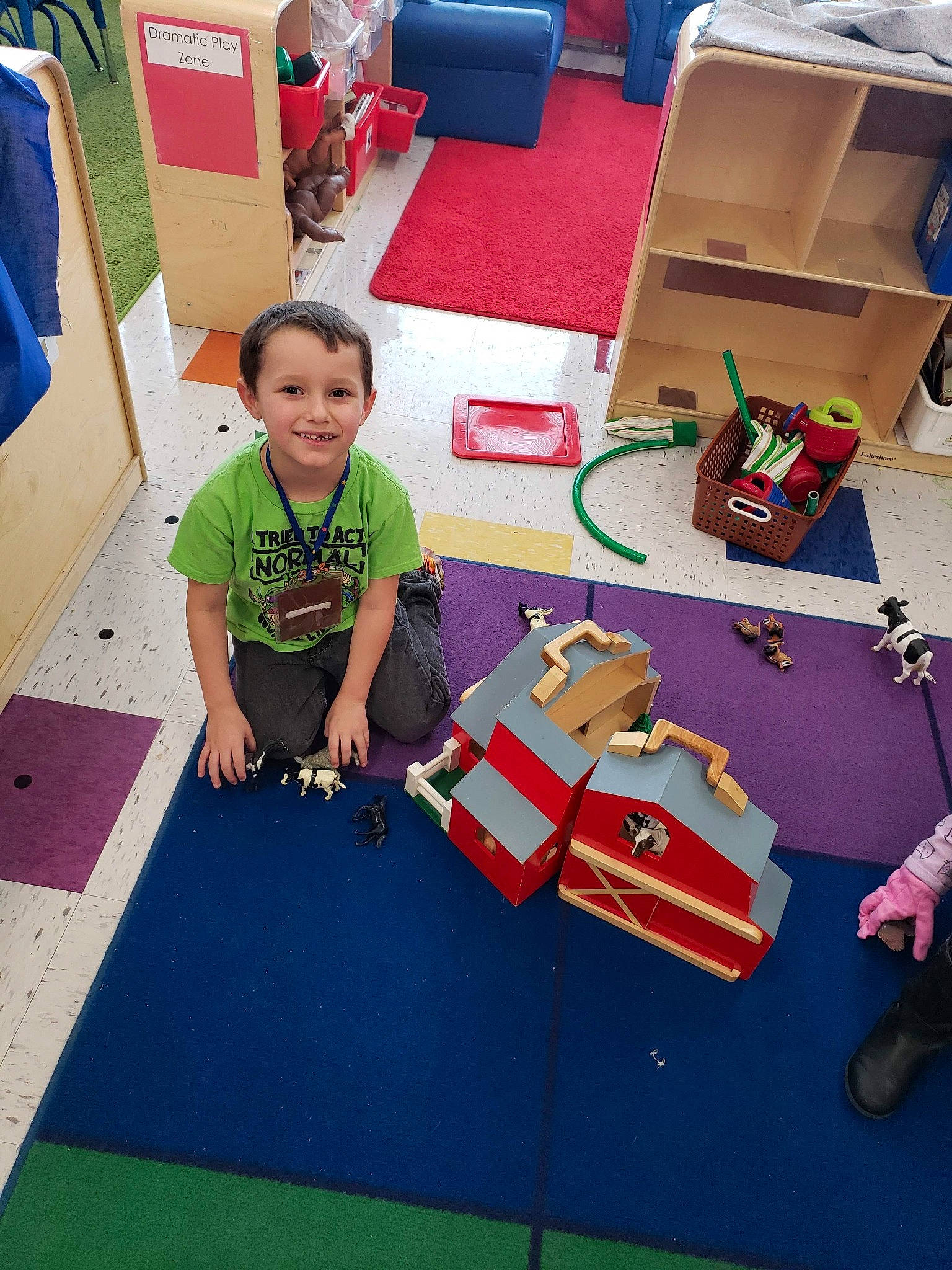 Isaiah is registered to the contest to win money with this photo: adaptation, art, carpet, child, floor, flooring, house, joy, kindergarten, learning, person, play, playset, recreation, school, table, toddler, toy, vehicle, visual_arts