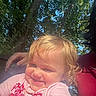 toddler, child, smiling, curly_hair, blonde_hair, pink_shirt, hearts, sunlight, outdoor, trees, greenery, person, happy, portrait, nature, daylight, cute, baby, face, casual_clothing