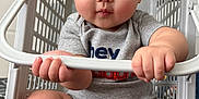 Bosco joined the competition — help win amazing prizes! baby, child, laundry_basket, grey_onesie, drool, hands, legs, bedroom, door, curious, cute, chubby_cheeks, sitting, indoor, plastic, furniture, floor, expression, person, infant