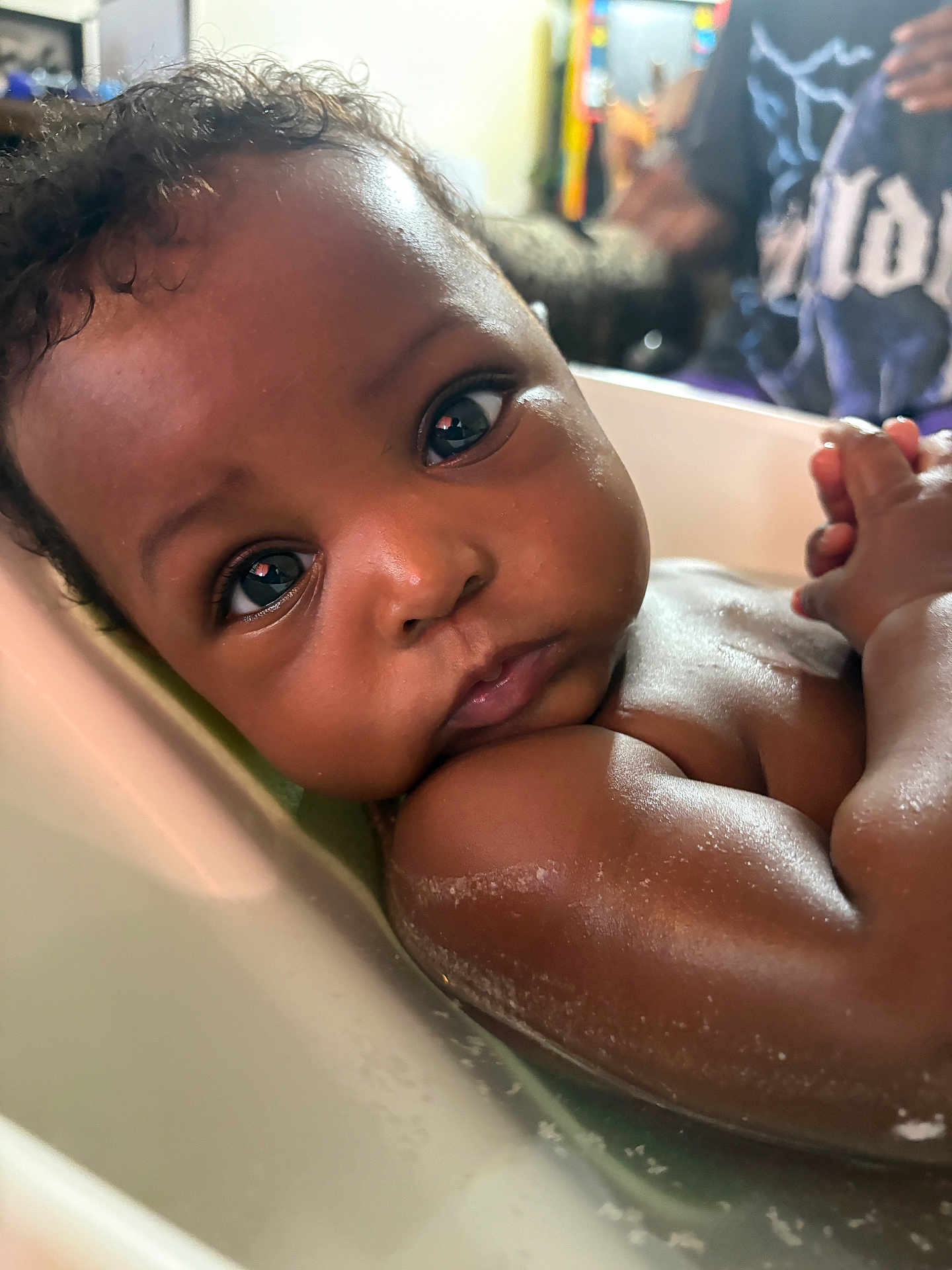 Jenesis joined the competition — help win amazing prizes! baby, child, bath, water, skin, face, eyes, expression, curly_hair, indoor, relaxation, close_up, cute, portrait, infant, person, young_child, moisture, tub, human