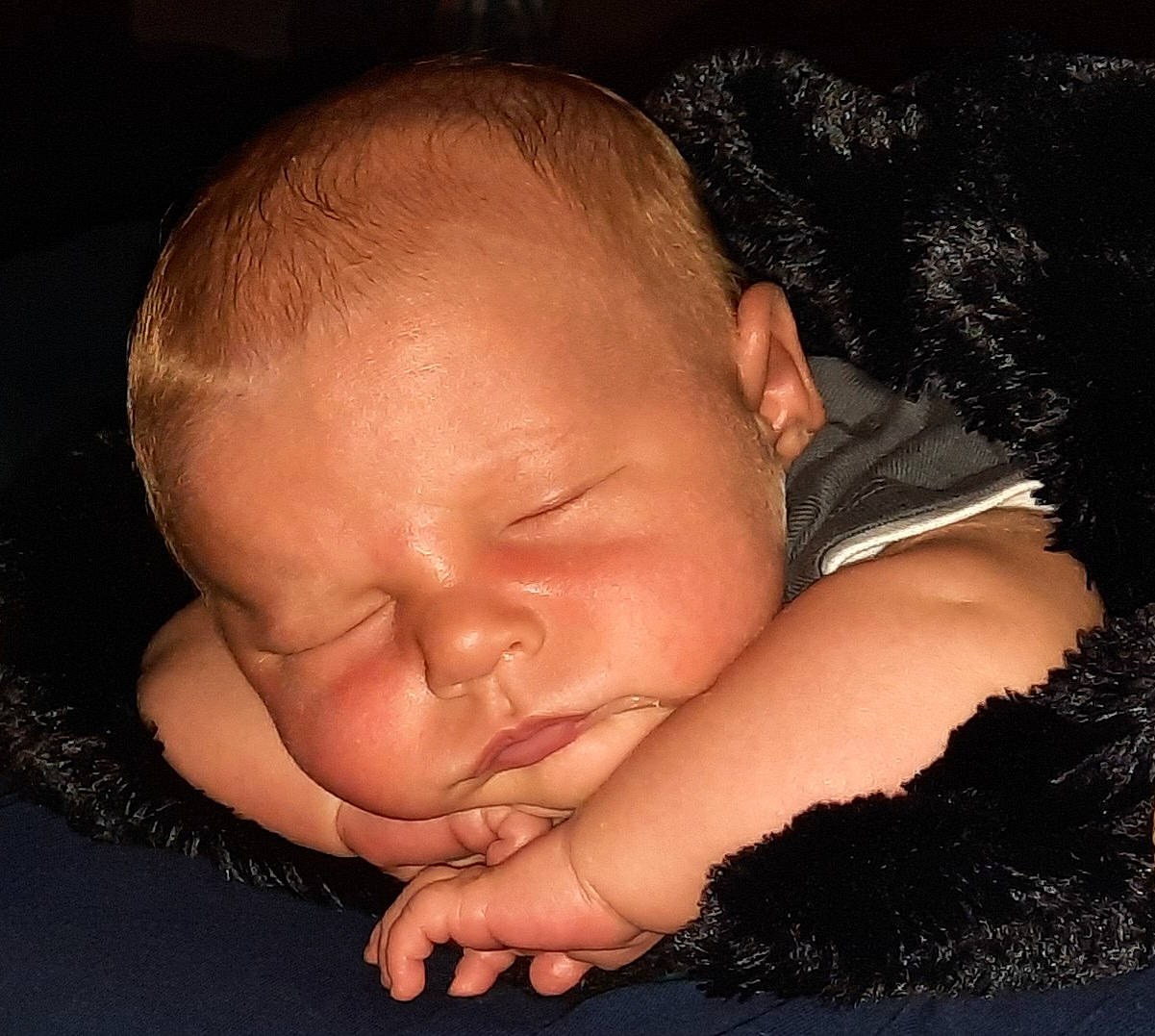 Jerry is registered to the contest to win money with this photo: baby, baby_toddler_clothing, bedtime, cheek, child, comfort, ear, eye, eyelash, finger, flash_photography, gesture, hair, happy, mouth, nail, nose, person, skin, thumb