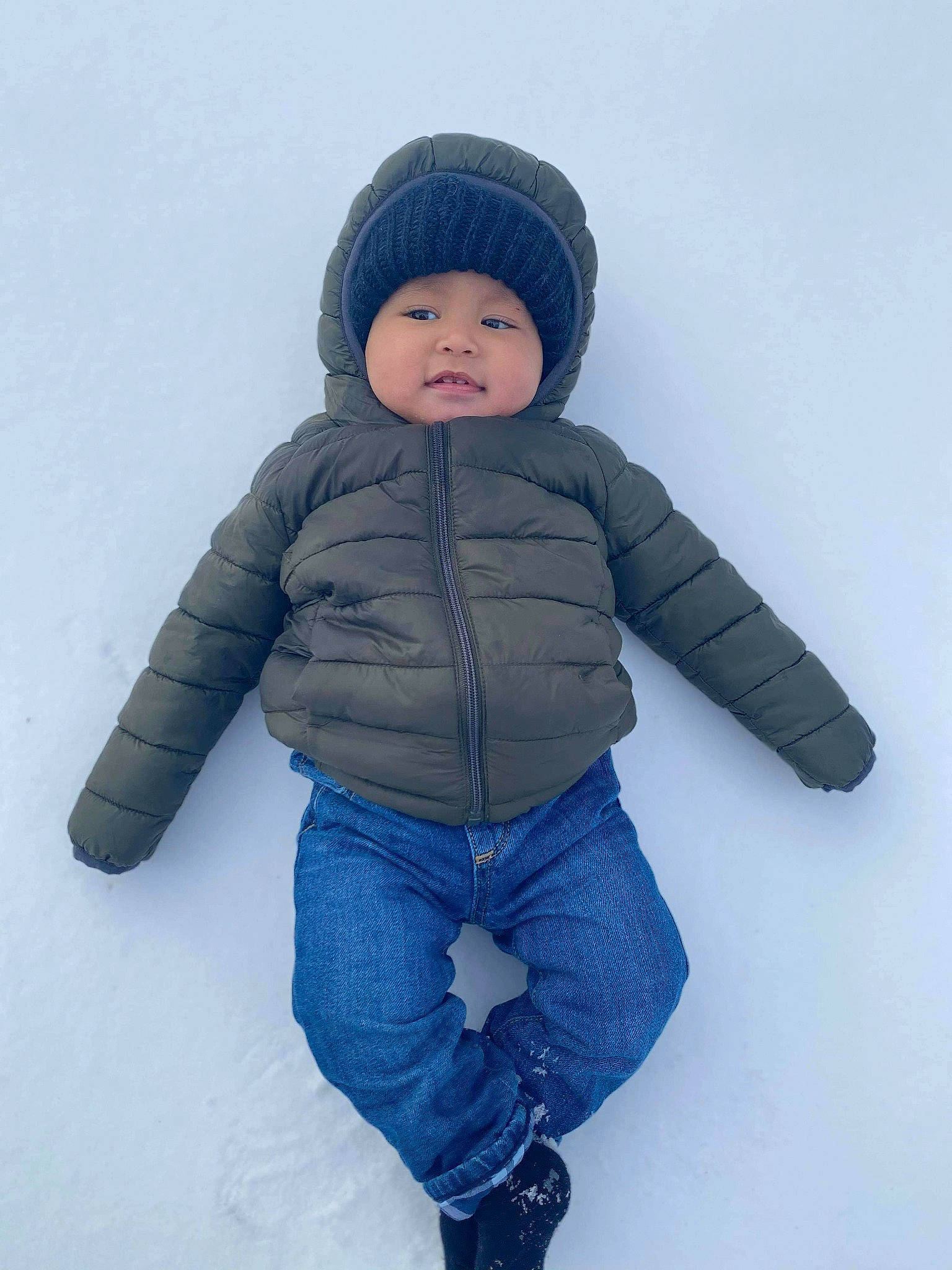 Warren is registered to the contest to win money with this photo: baby_toddler_clothing, beanie, blue, bonnet, cheek, child, clothing, comfort, cool, denim, freezing, headwear, hood, jacket, jeans, person, sleeve, snow, textile, toddler