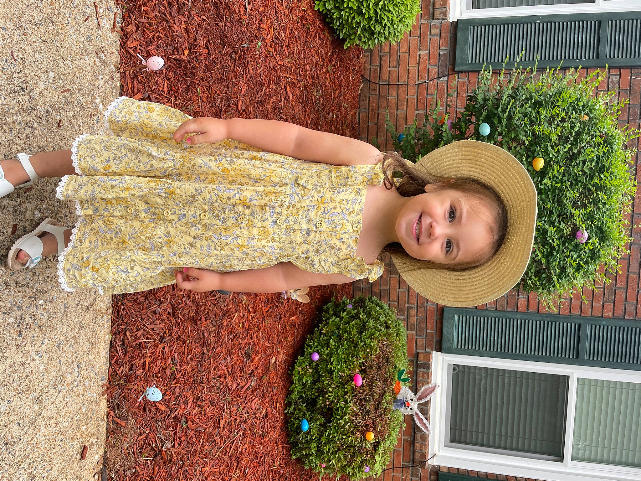 Sutton is registered to the contest to win money with this photo: cocktail_dress, day_dress, dress, event, fashion_accessory, floral_design, flower, flower_arranging, garden, grass, hat, joy, pattern, person, pink, plant, smile, sun_hat, waist, window