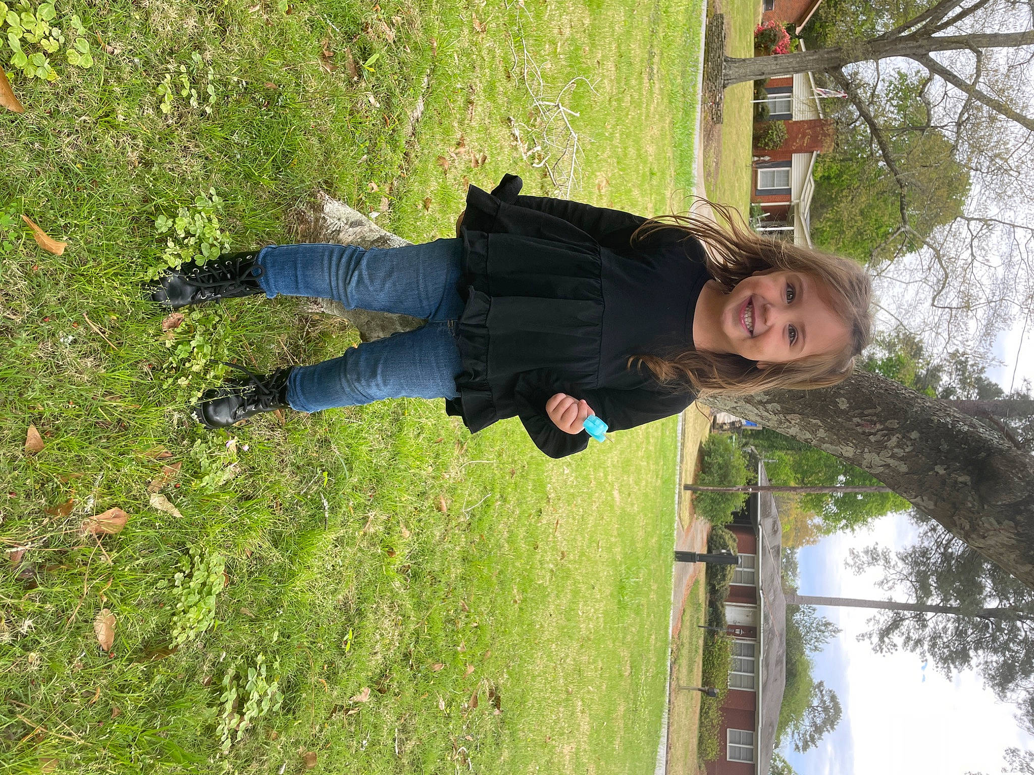 Sutton is registered to the contest to win money with this photo: fun, grass, happy, joy, leisure, people_in_nature, person, plant, sky, smile, tree, trunk, wood