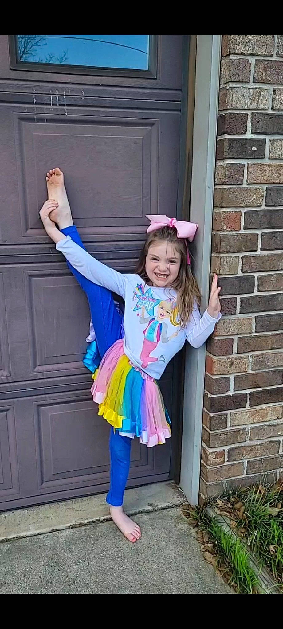 Carly joined the competition — help win amazing prizes! azure, brick, brickwork, child, costume, door, electric_blue, fun, glove, happy, hat, joy, magenta, person, pink, plant, purple, smile, snapshot, standing