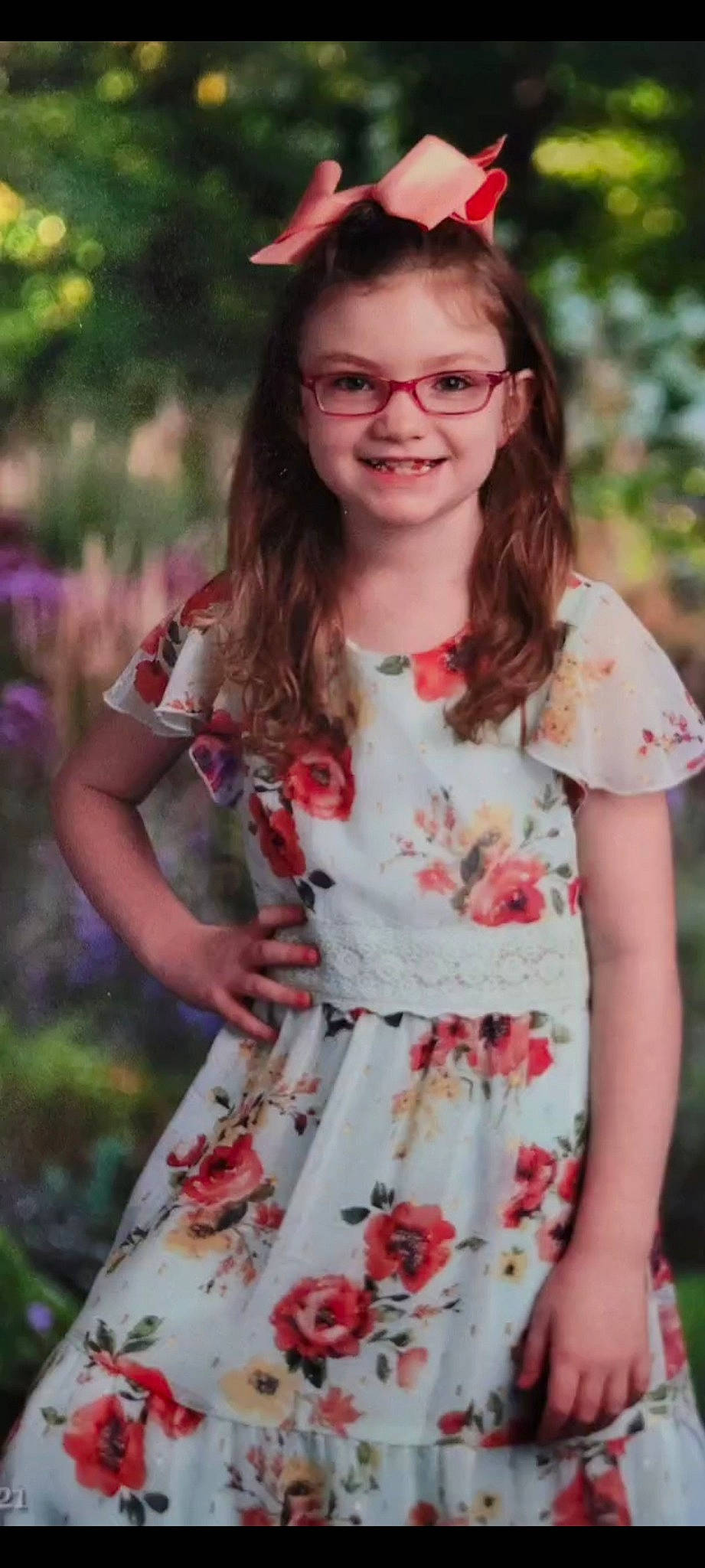 Carly is registered to the contest to win money with this photo: day_dress, dress, face, facial_expression, fashion, glasses, grass, hairstyle, happy, head, joy, lip, one_piece_garment, person, pink, plant, red, sleeve, smile, street_fashion