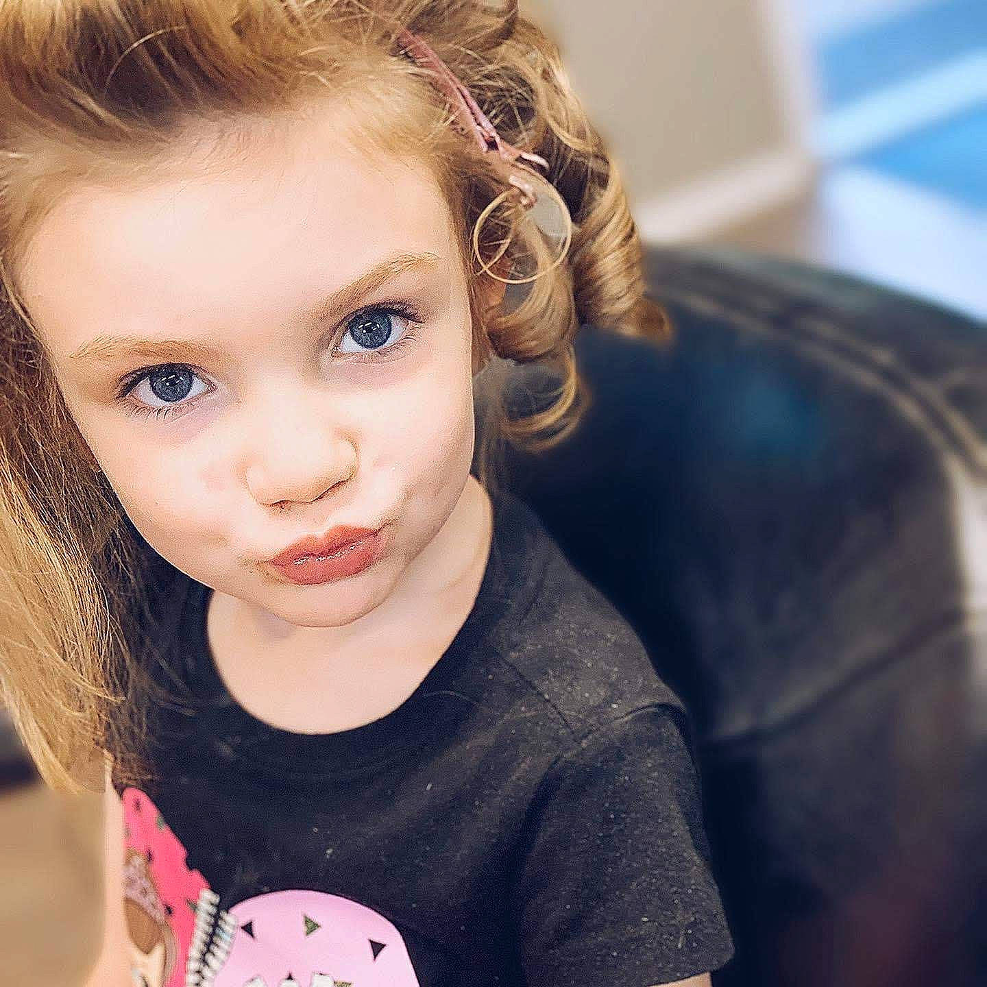 Carly joined the competition — help win amazing prizes! baby_toddler_clothing, black_hair, blond, cheek, cool, ear, eyelash, forehead, happy, iris, jaw, lip, long_hair, mammal, neck, nose, person, skin, sleeve, t_shirt