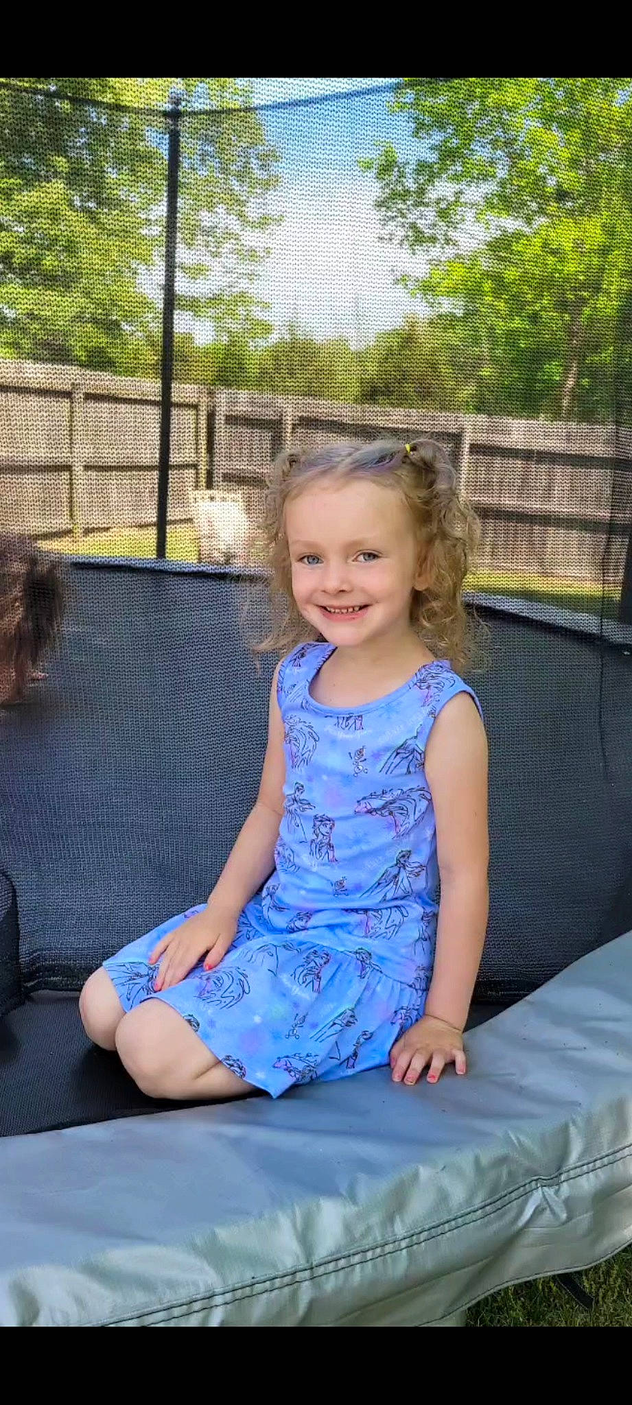 Lilly is registered to the contest to win money with this photo: baby_toddler_clothing, dress, electric_blue, eye, facial_expression, flash_photography, fun, grass, hairstyle, happy, joy, leg, leisure, person, recreation, sitting, sky, smile, summer, thigh