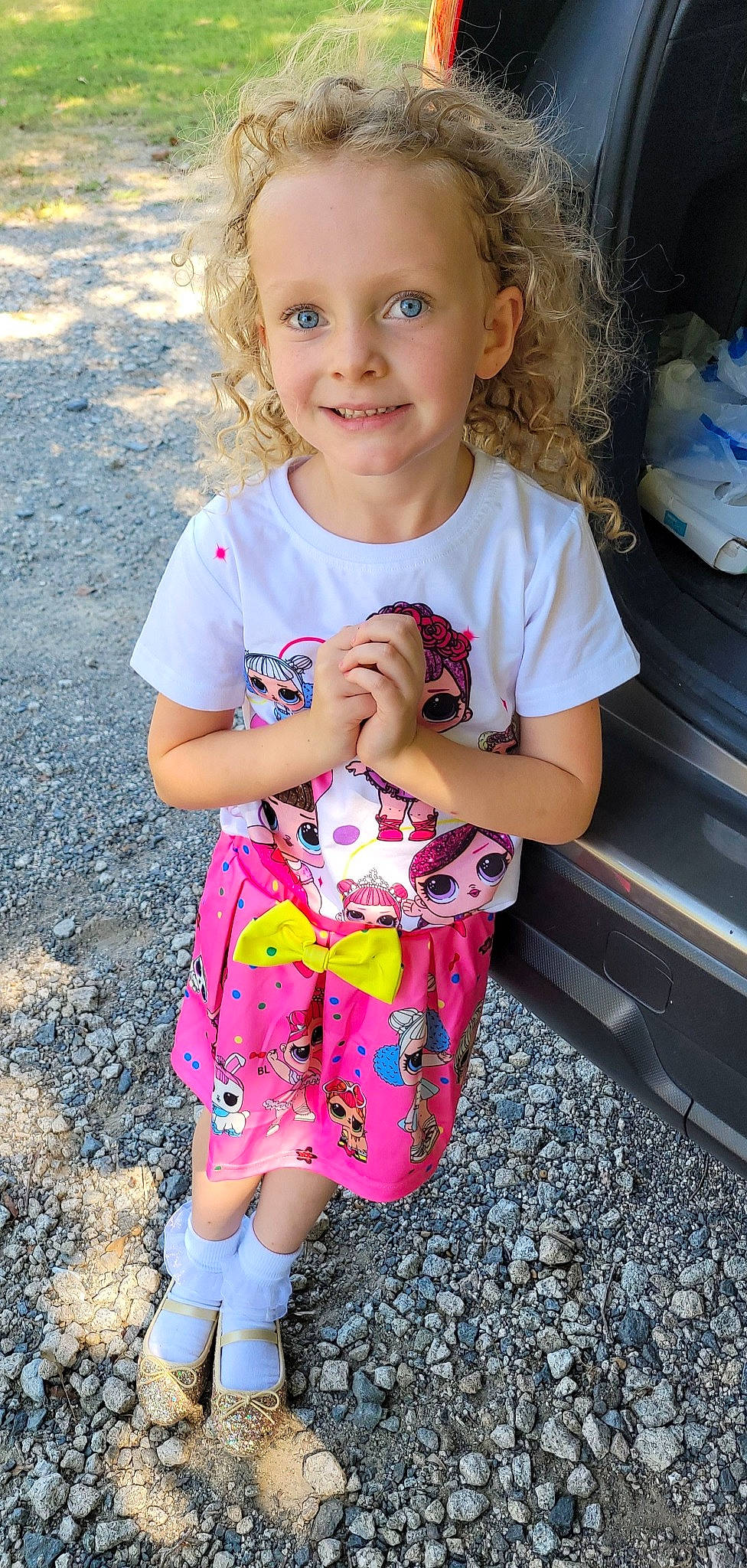 Lilly is registered to the contest to win money with this photo: baby_toddler_clothing, clothing, cool, dress, finger, fun, gesture, hairstyle, hand, happy, human_body, joint, joy, organ, people_in_nature, person, pink, skin, sleeve, smile