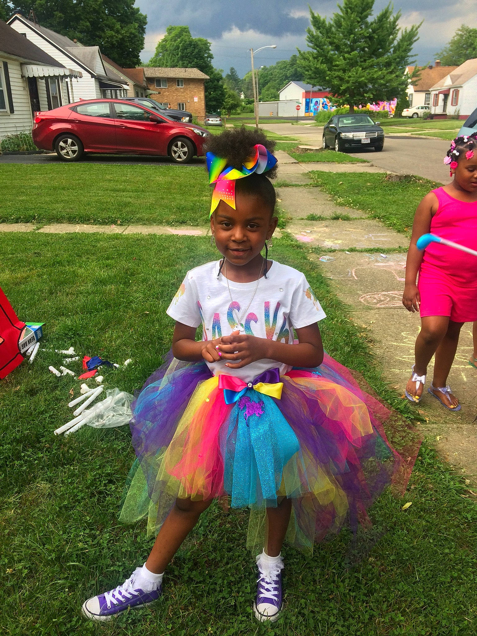 Egypt is registered to the contest to win money with this photo: car, cloud, fun, grass, green, happy, joy, leisure, outdoor_recreation, person, pink, plant, recreation, sky, summer, sunglasses, tire, toddler, tree, vehicle