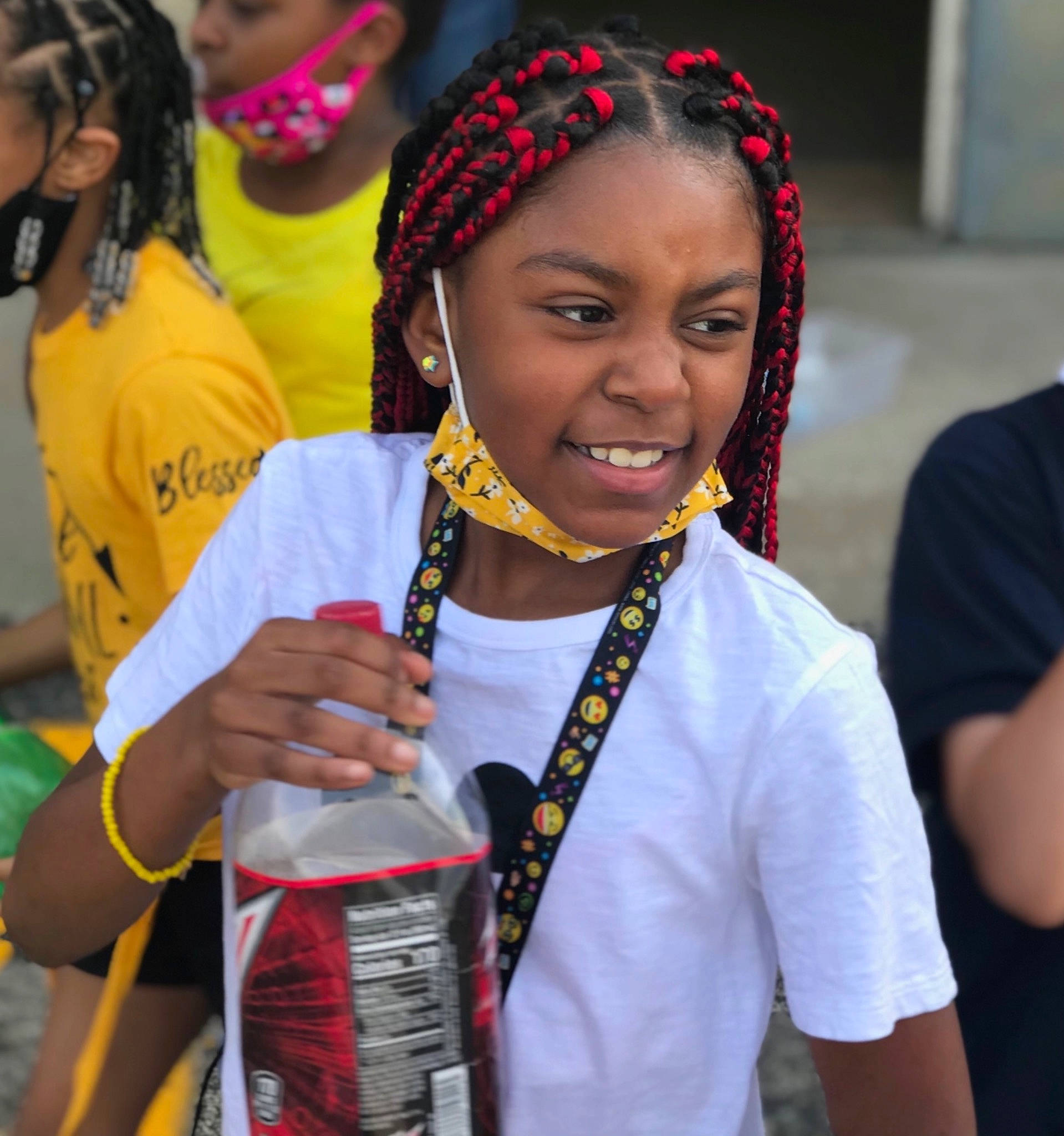 Egypt is registered to the contest to win money with this photo: braid, child, cornrows, earrings, event, eyewear, fashion_accessory, fun, happy, headpiece, jewellery, joy, leisure, necklace, person, public_event, recreation, smile, t_shirt, tradition