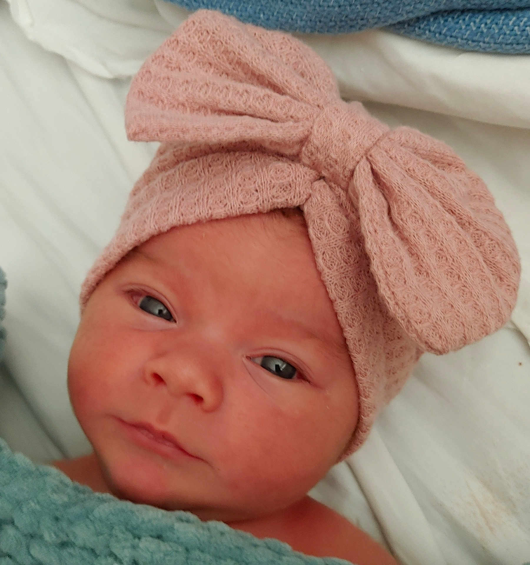 Savana participe au concours pour gagner de l'argent avec cette photo : baby, infant, face, headband, pink, blue, blanket, closeup, newborn, portrait, sleeping, soft, cute, child, bed, resting, skin, human, eyes, expression
