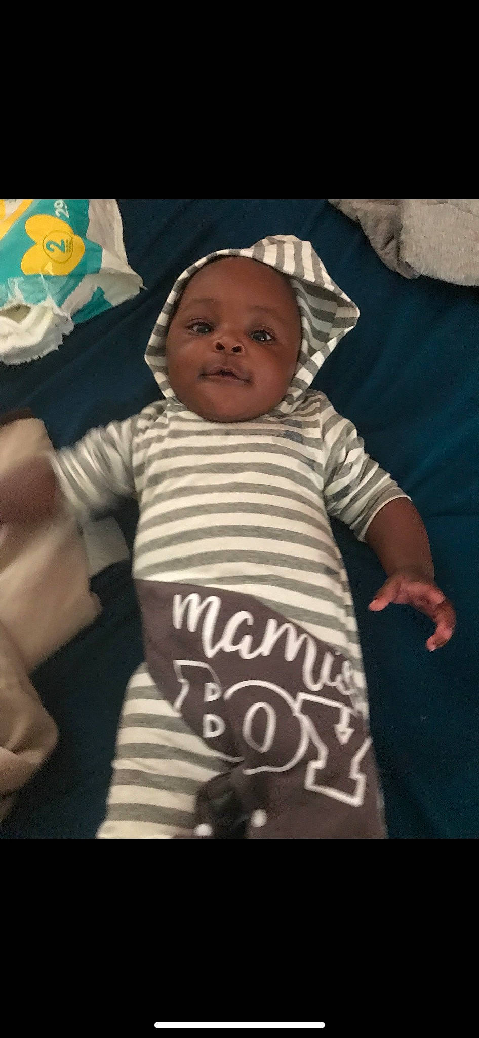 Jakari is registered to the contest to win money with this photo: baby, baby_products, baby_safety, baby_sleeping, baby_toddler_clothing, cheek, child, cool, finger, fun, gesture, happy, jersey, linens, outerwear, person, sleeve, smile, sportswear, t_shirt