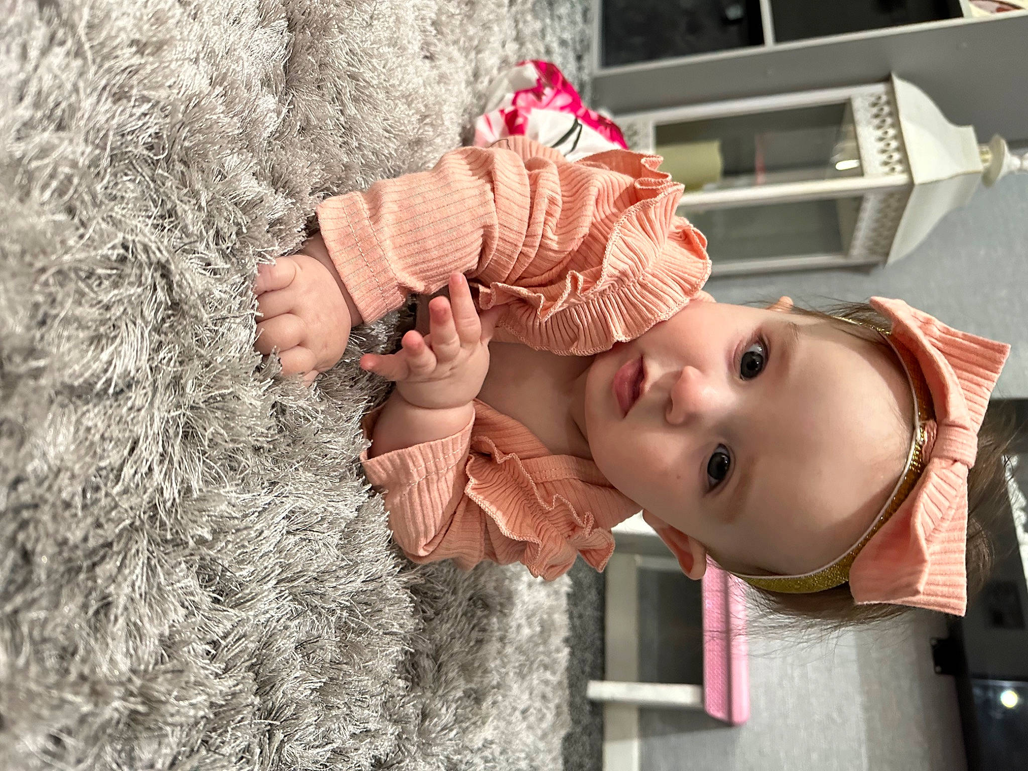 Lily is registered to the contest to win money with this photo: baby, baby_toddler_clothing, child, fun, grass, happy, hat, human, lip, nose, pattern, person, pink, plant, red, skin, smile, textile, toddler, tree