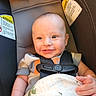 Max joined the competition — help win amazing prizes! baby, car_seat, smile, child, infant, blanket, seatbelt, safety, happy, portrait, indoor, clothing, person, cute, head, face, seat, warning_label, baby_clothes, infant_boy