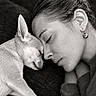 Bidule a rejoint le concours — aidez-le/la à gagner de superbes lots ! dog, woman, portrait, black_and_white, close_up, cuddle, affection, sleeping, resting, nose_to_nose, pet, human, face, ear, earring, sweater, furry, indoors, intimate, monochrome