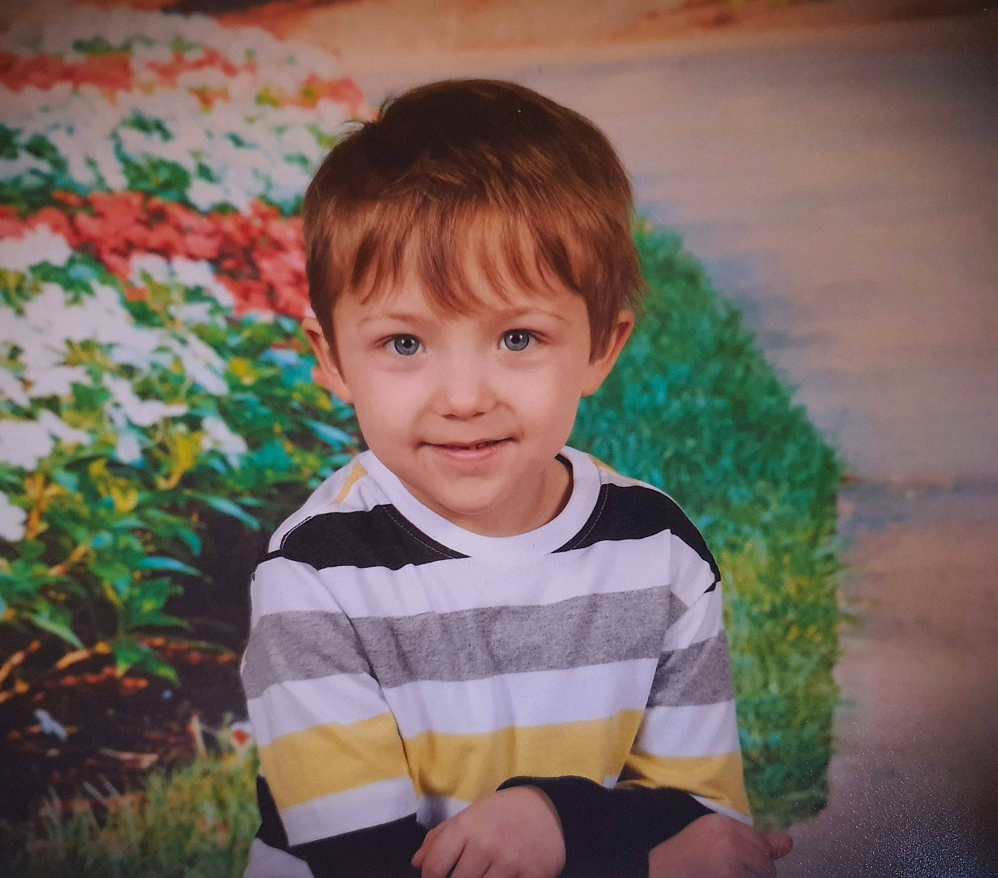 Cameryn is registered to the contest to win money with this photo: baby_toddler_clothing, bangs, child, facial_expression, flash_photography, flooring, fun, grass, happy, iris, joy, people_in_nature, person, plant, sitting, sleeve, smile, t_shirt, tints_and_shades, toddler