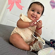 Adrially joined the competition — help win amazing prizes! baby, bed, bracelet, child, dress, face, fashion, happy, home, indoors, infant, person, photography, pink_bow, portrait, purse, shoes, sitting, smiling, wall