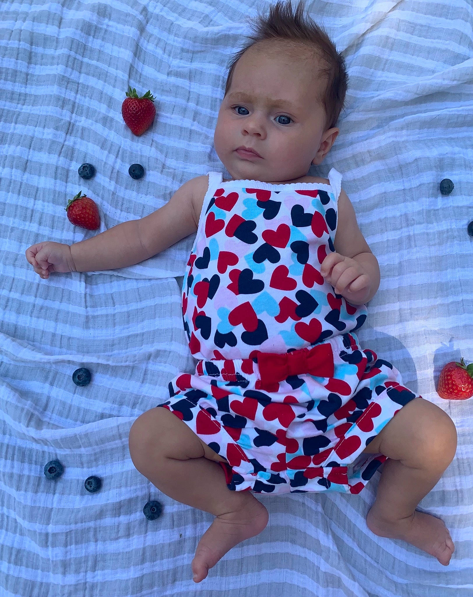 Charlotte is registered to the contest to win money with this photo: azure, baby, baby_toddler_clothing, child, day_dress, design, dress, electric_blue, joint, magenta, one_piece_garment, pattern, person, pink, plaid, purple, sleeve, t_shirt, textile, toddler