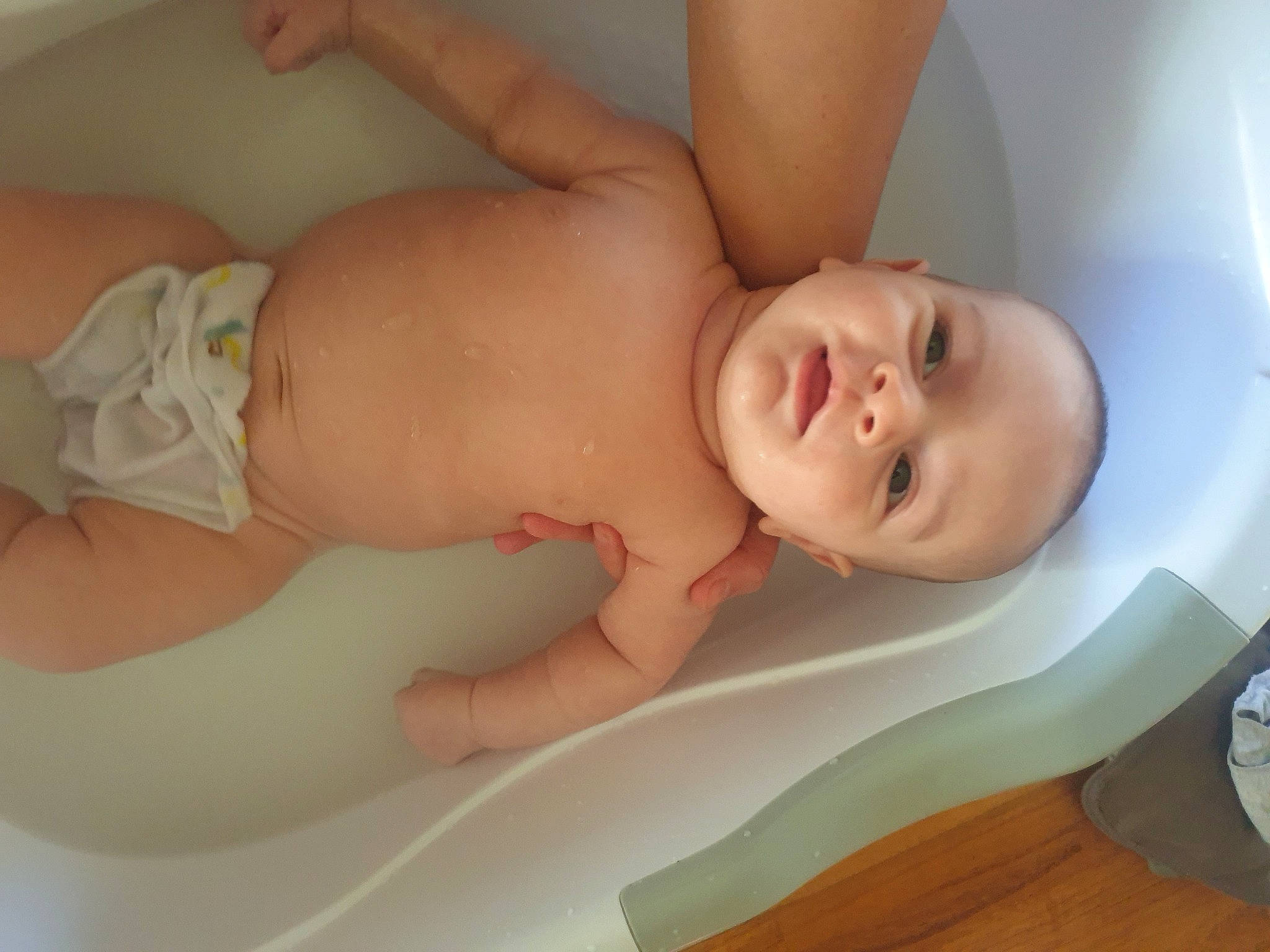Madden is registered to the contest to win money with this photo: baby, baby_products, bathing, bathtub, child, hand, person, product, skin, toddler