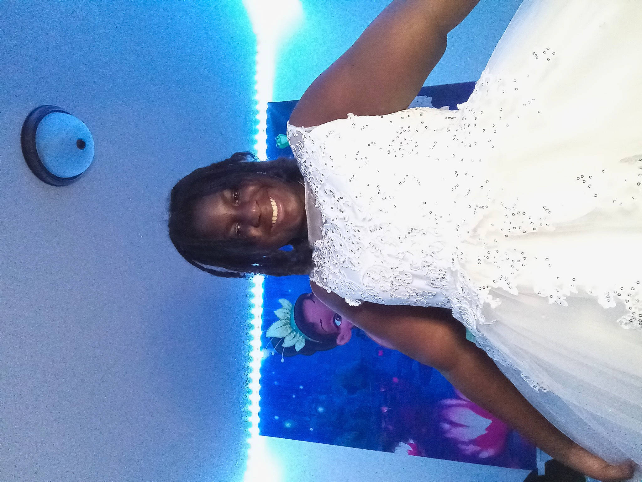 Lakeah is registered to the contest to win money with this photo: arm, azure, blue, bridal_accessory, bridal_clothing, bride, elbow, electric_blue, event, formal_wear, fun, gesture, happy, joy, light, lighting, person, purple, sky, smile