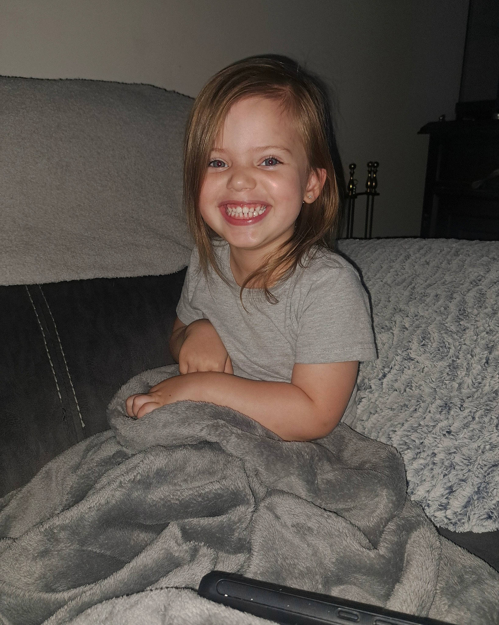 Avery is registered to the contest to win money with this photo: cheek, comfort, couch, elbow, flash_photography, fun, hair, hairstyle, happy, human_body, human_leg, joy, knee, lap, mouth, person, room, sitting, skin, smile