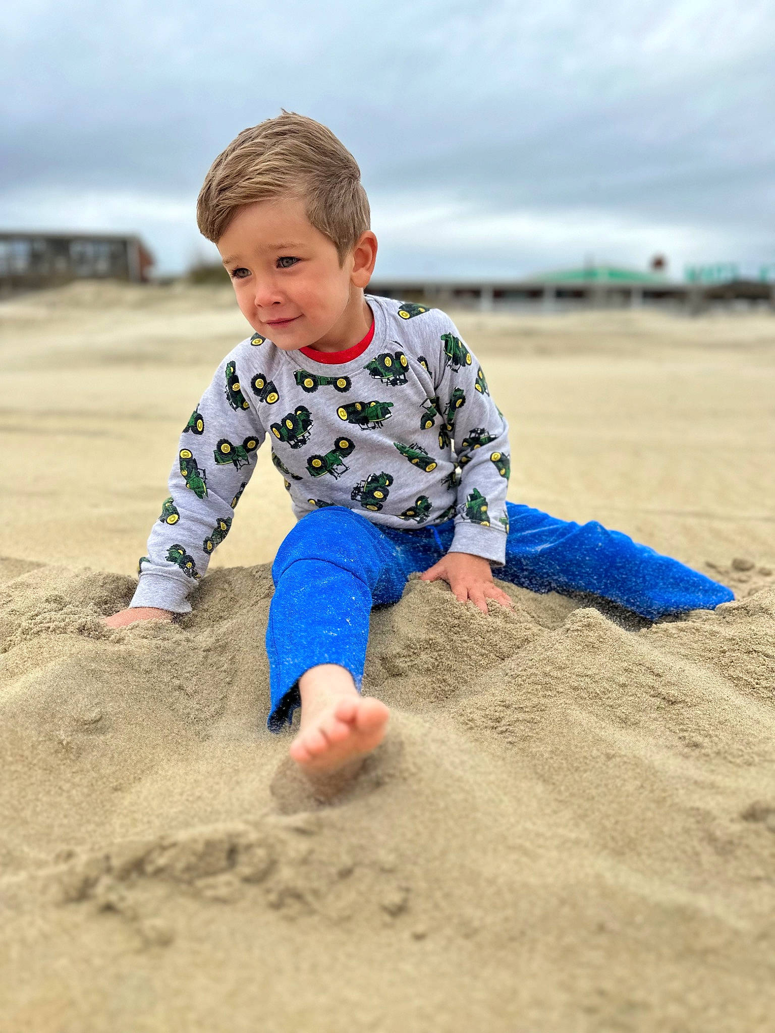 Brooks is registered to the contest to win money with this photo: barefoot, beach, child, cloud, fun, happy, horizon, landscape, leisure, people_in_nature, people_on_beach, person, recreation, sand, sky, sleeve, smile, soil, t_shirt, toddler