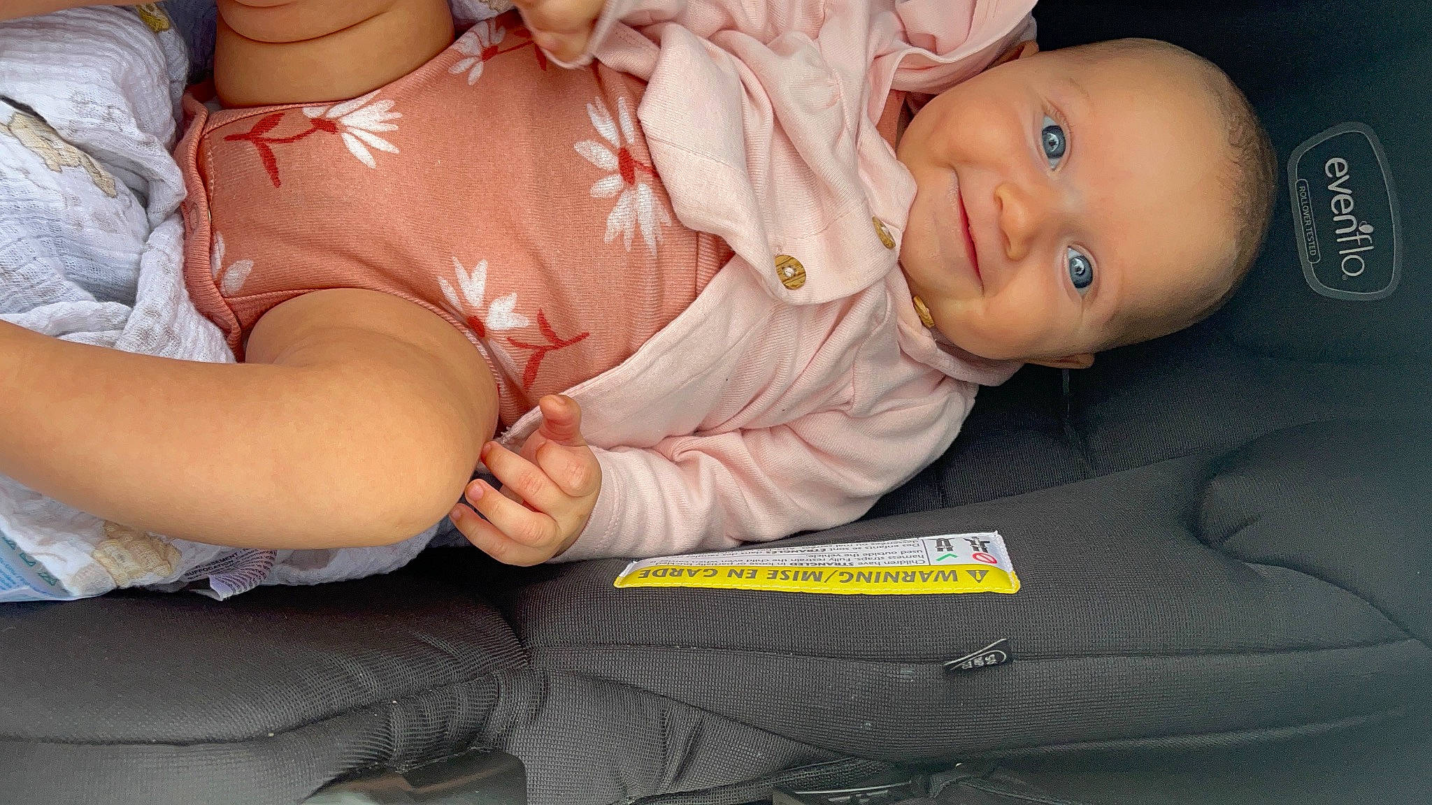 Evie is registered to the contest to win money with this photo: arm, baby, comfort, eye, facial_expression, finger, flash_photography, gesture, hand, head, human_body, leg, mouth, muscle, organ, person, product, skin, smile, stomach