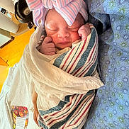 Alayah joined the competition — help win amazing prizes! newborn, baby, sleeping, wrapped, blanket, hospital, bow, hat, infant, peaceful, fist, cute, soft, linens, bed, person, portrait, closeup, tiny, cozy