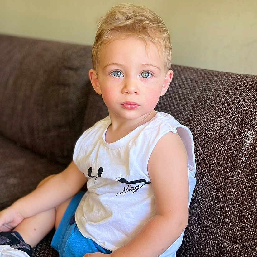 Marsel joined the competition — help win amazing prizes! blonde, boy, child, clothing, couch, cushion, face, footwear, furniture, hair, head, male, pants, person, photography, portrait, shoe, shorts, sitting, t_shirt