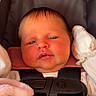 Jessie is registered to the contest to win money with this photo: newborn, baby, infant, child, car_seat, harness, portrait, face, eyes, sleepy, serious_expression, indoors, blanket, pink_blanket, clothing, head, seated, close_up, photography, safe
