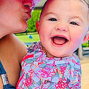 Azalea joined the competition — help win amazing prizes! baby, child, adult, kiss, hat, smile, happy, outdoor, sunny, colorful_clothing, floral_pattern, close_up, person, holding, face, skin, portrait, joy, affection, family