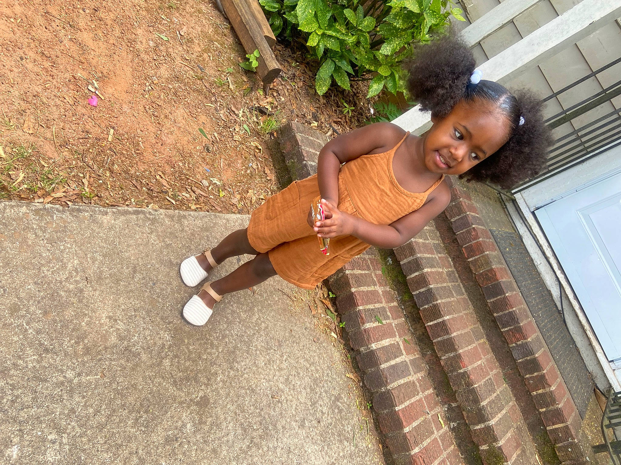 Amari joined the competition — help win amazing prizes! asphalt, child, flooring, foot, fun, grass, human_leg, knee, leg, leisure, pattern, person, plant, road_surface, sandal, sidewalk, soil, thigh, toddler, waist