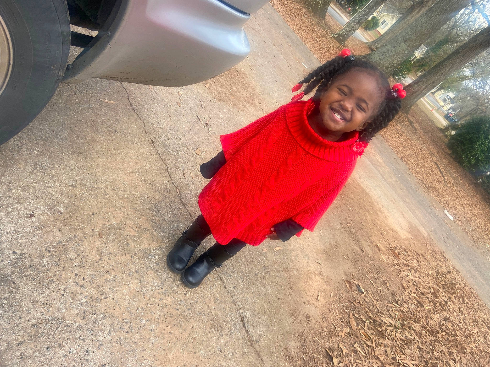 Amari joined the competition — help win amazing prizes! asphalt, automotive_tire, automotive_wheel_system, car, fender, floor, flooring, happy, joy, person, personal_luxury_car, road, road_surface, sidewalk, smile, t_shirt, tints_and_shades, tire, toddler, trunk