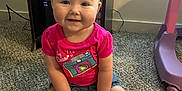 Arabella joined the competition — help win amazing prizes! baby, child, smiling, pink_shirt, camera_graphic, carpet, indoor, furniture, toy, shorts, sitting, hands, feet, happy, cute, person, face, head, floor, window