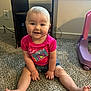 baby, child, smiling, pink_shirt, camera_graphic, carpet, indoor, furniture, toy, shorts, sitting, hands, feet, happy, cute, person, face, head, floor, window