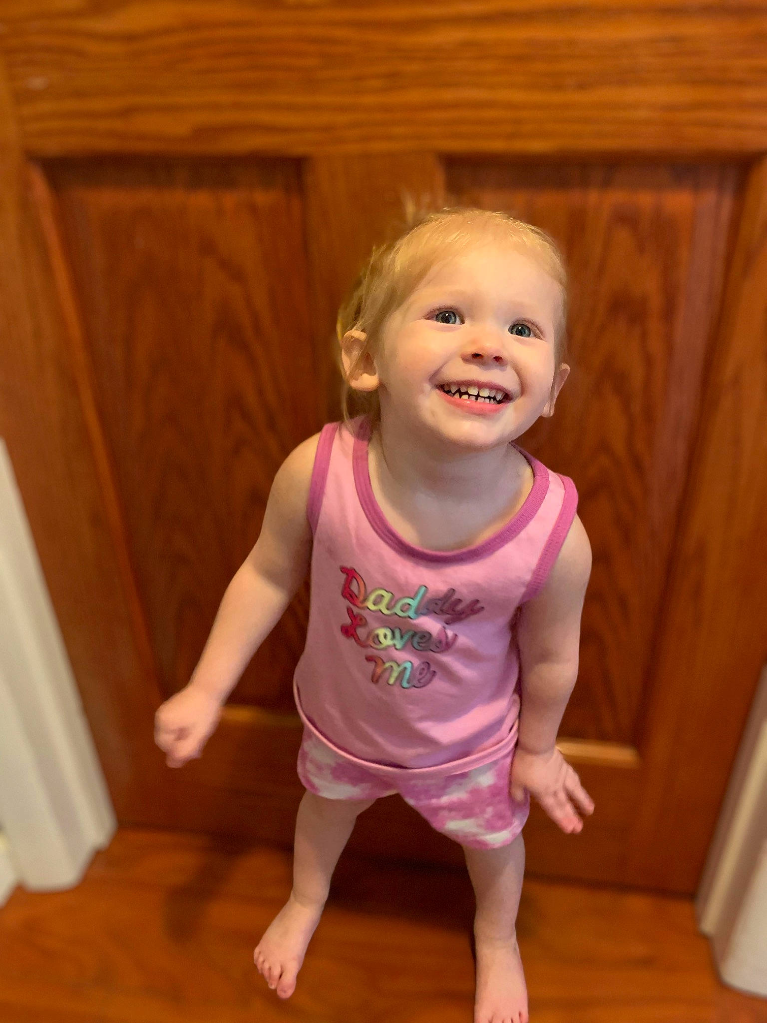 Novaleigh is registered to the contest to win money with this photo: baby_toddler_clothing, cheek, face, floor, flooring, hair, happy, hardwood, iris, joy, mouth, neck, person, pink, skin, sleeve, smile, standing, toddler, waist