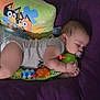 Kadien joined the competition — help win amazing prizes! baby, cartoon_pillow, child, colorful_toy, cozy, crawling_outfit, cute, face, hand, indoor, infant, pacifier, peaceful, pillow, purple_bedspread, resting, sleeping, soft_surface, toddler, toy