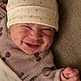 Janna a rejoint le concours — aidez-le/la à gagner de superbes lots ! baby, smile, hat, pajamas, blanket, face, hand, cozy, cute, infant, sleepwear, happy, newborn, child, soft, texture, closeup, indoors, portrait, expression