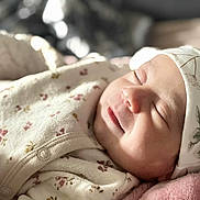 Janna participe au concours pour gagner de l'argent avec cette photo : baby, newborn, sleeping, blanket, hat, floral, soft, cozy, closeup, face, infant, peaceful, cute, clothing, portrait, resting, indoors, warm, comfort, skin